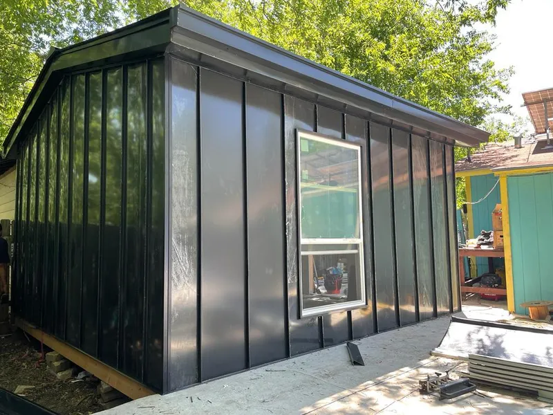 Black standing seam metal wall panels for Roof Inspection in Irondale